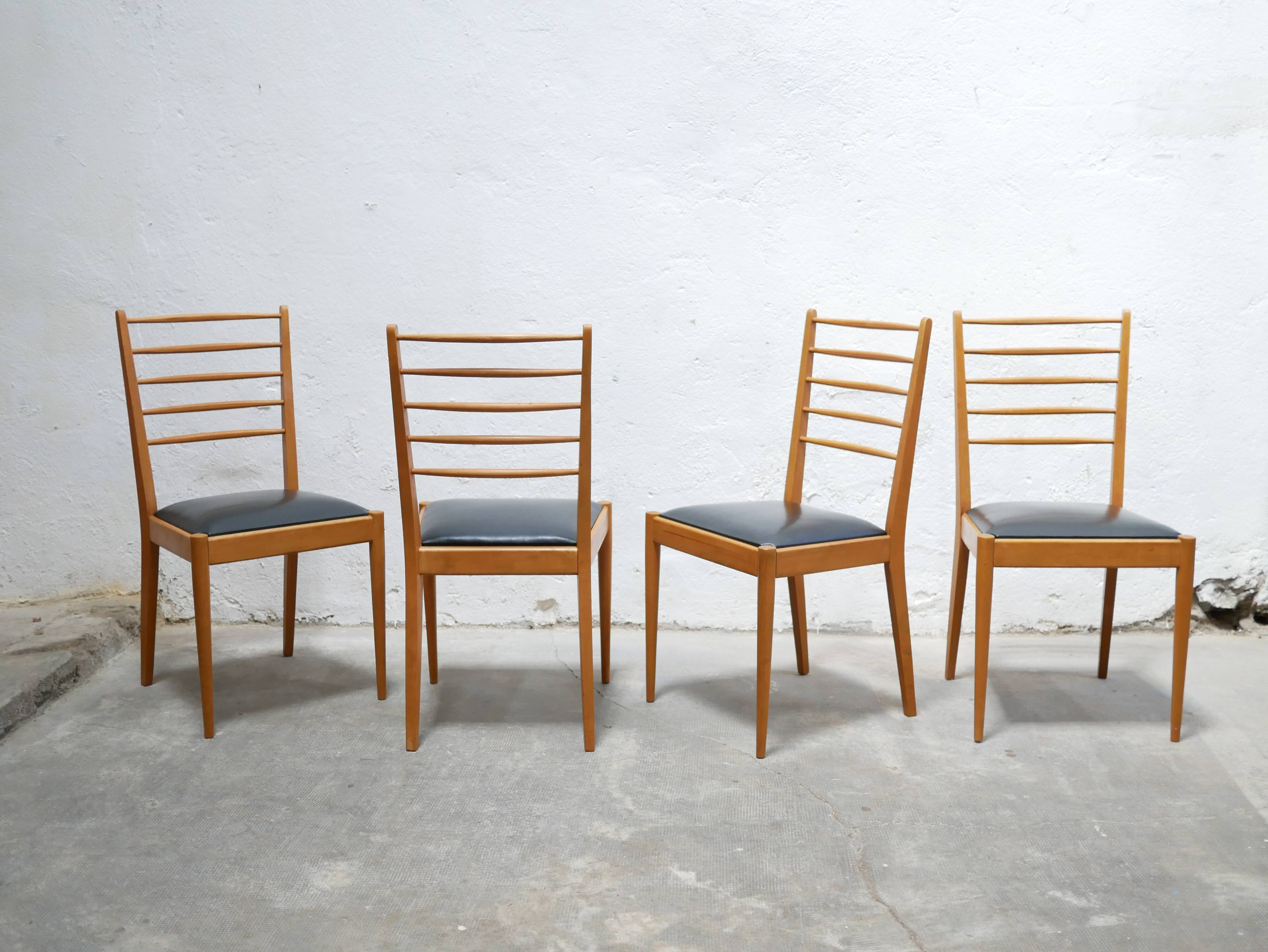 Series of 4 vintage chairs in wood and skaï