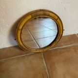 Old rattan mirror with porthole shape