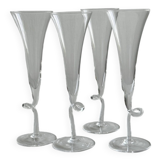 4 stemmed glasses, flutes with transparent twisted stem.