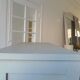 Vintage furniture transformed into a bookcase, verdigris patinated sideboard.
