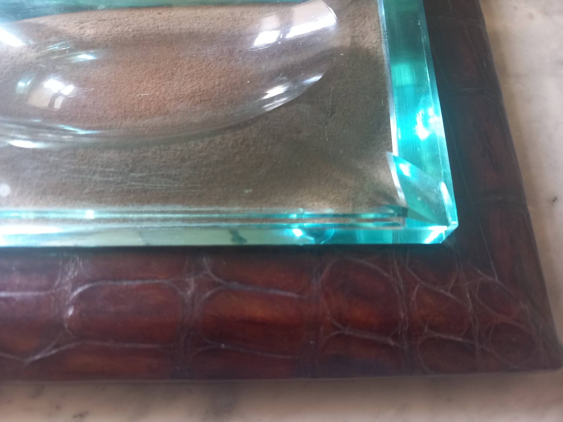 Crocodile leather ashtray with cut crystal.