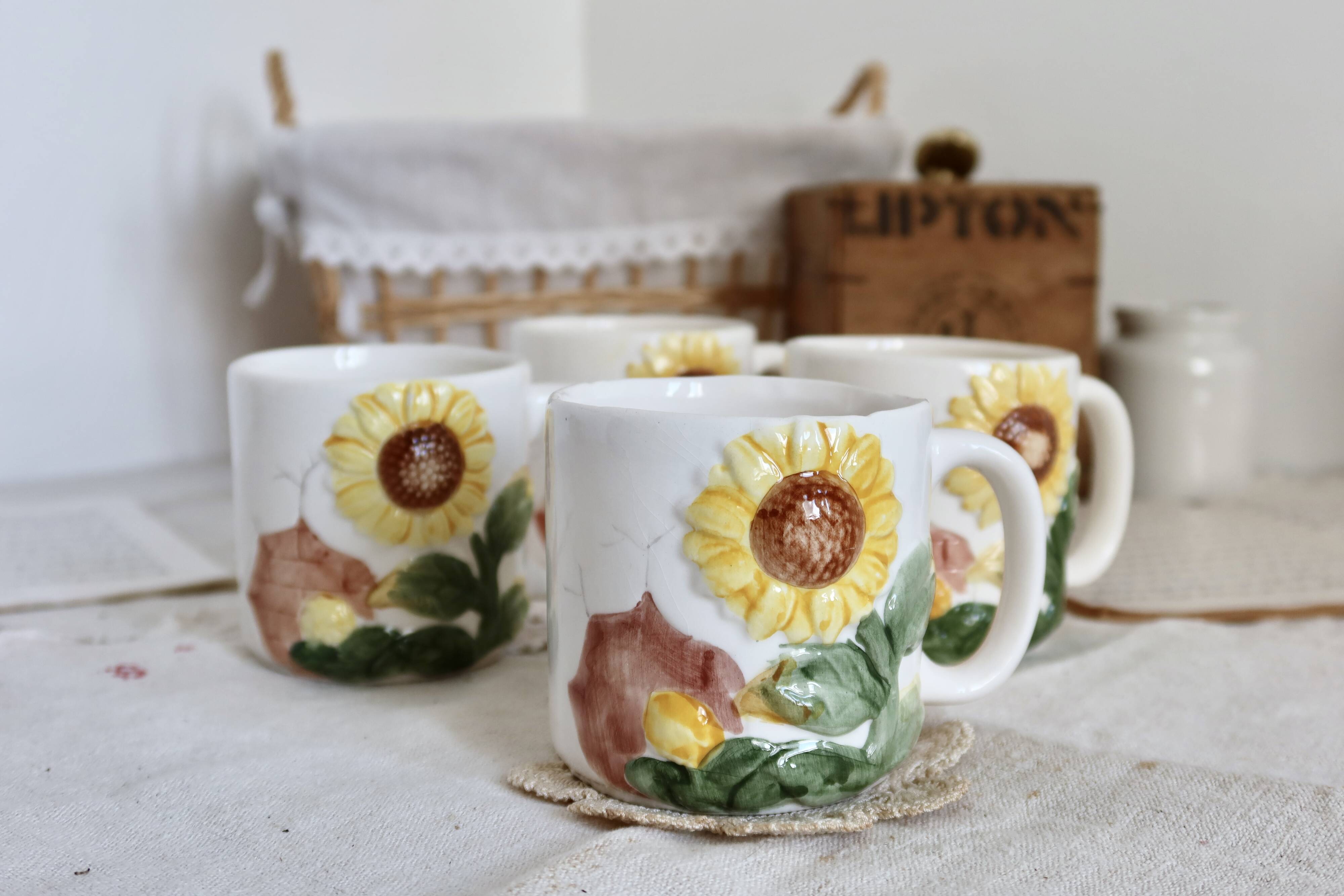 Set of 4 vintage barbotine cups / mugs with polychrome sunflower pattern