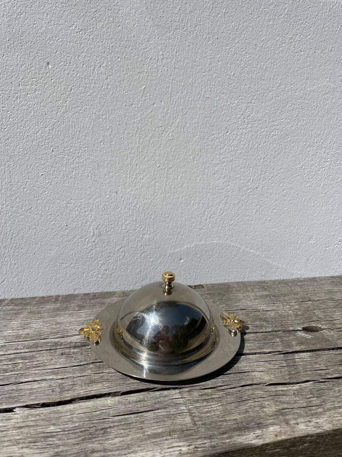 Silver-plated metal butter dish with knots