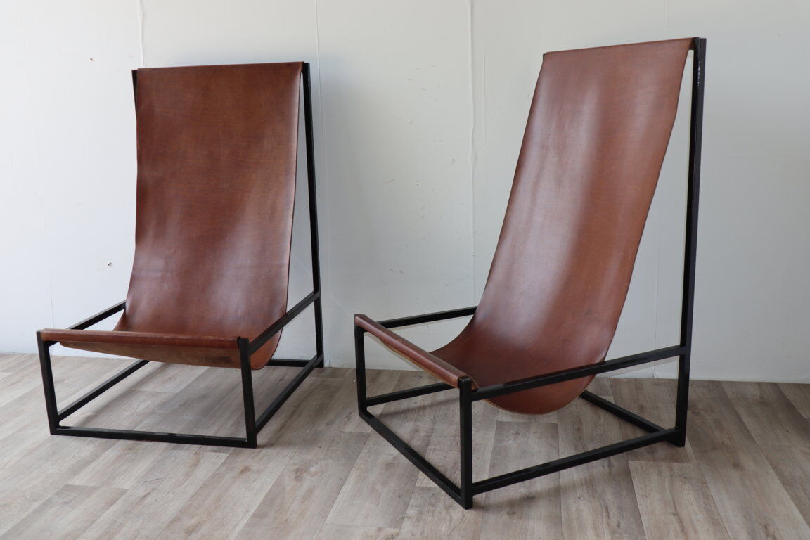 Pair of vintage armchairs in stretched leather and metal structure
