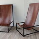 Pair of vintage armchairs in stretched leather and metal structure