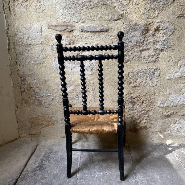 Low chair in turned wood
