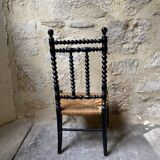 Low chair in turned wood
