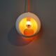 White openwork pendant light with orange interior 1970/1980.