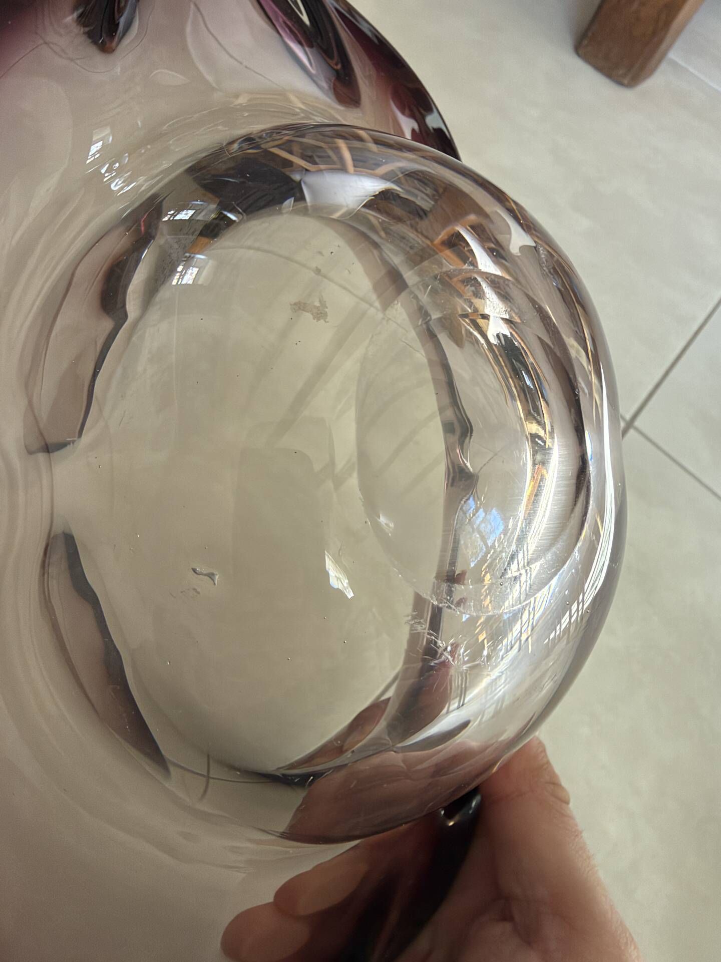 Blown glass fruit bowl in Murano style with purple reflections.
