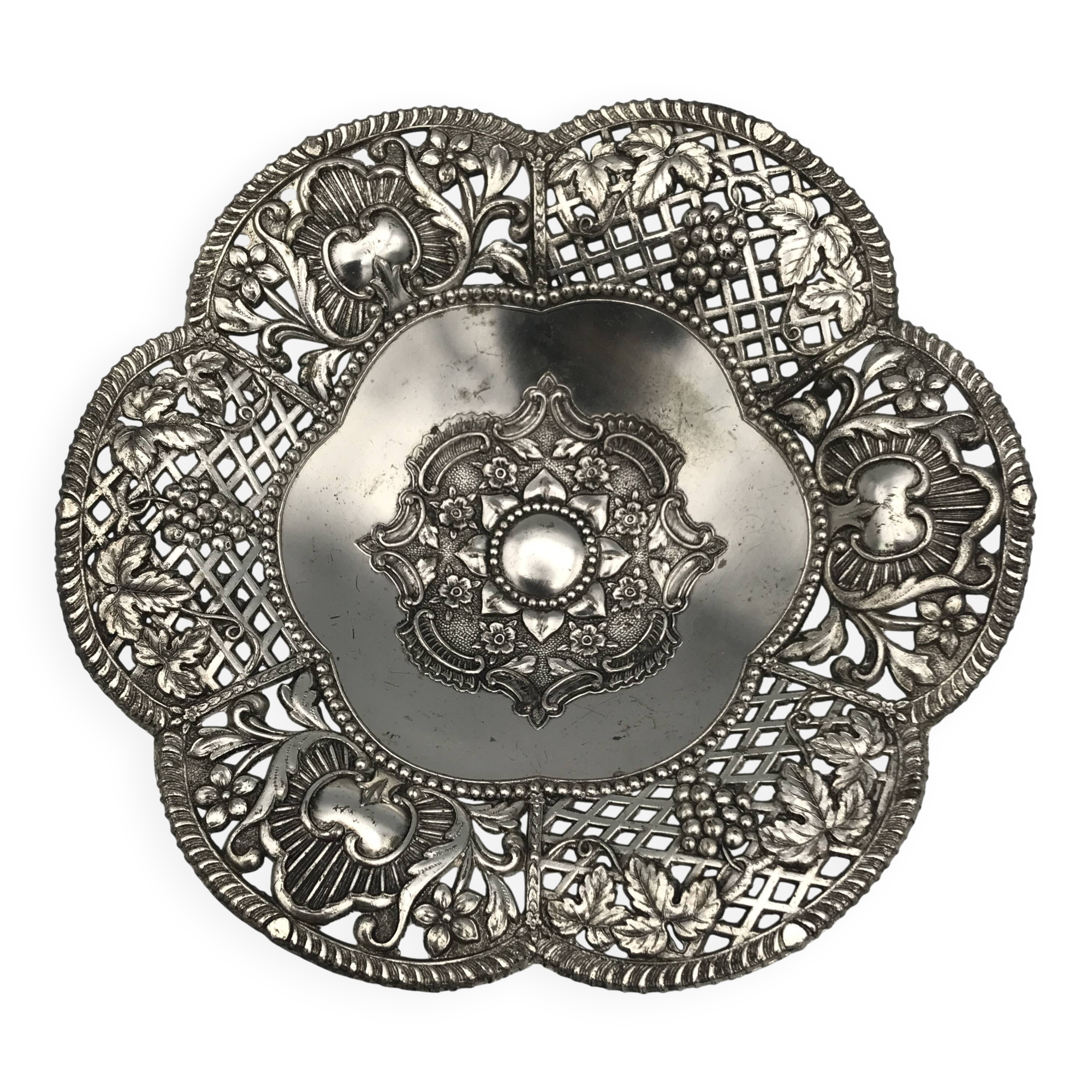Silver-plated metal pocket emptier with openwork outline decoration
