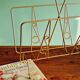 Golden metal magazine holder