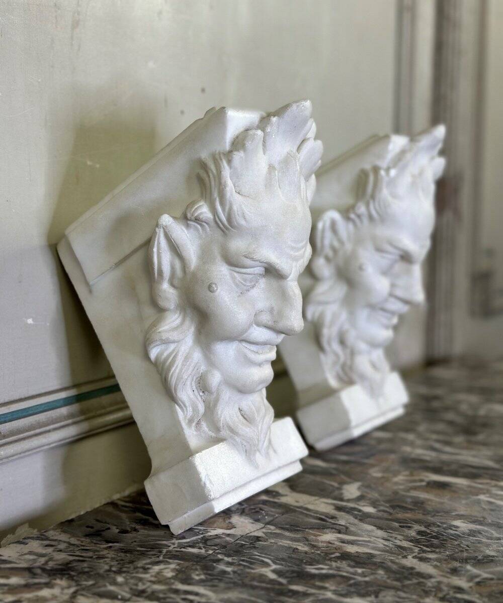 Pair of white statuary marble consoles, with faun heads