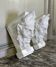 Pair of white statuary marble consoles, with faun heads