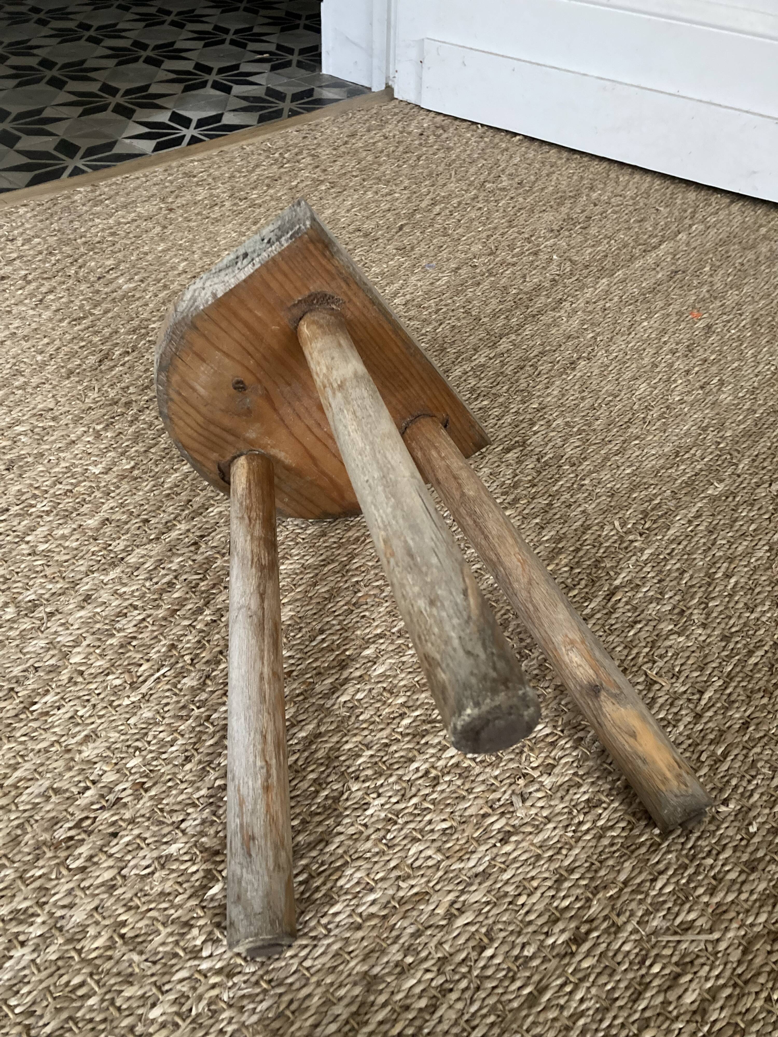 Antique brutalist wooden tripod stool