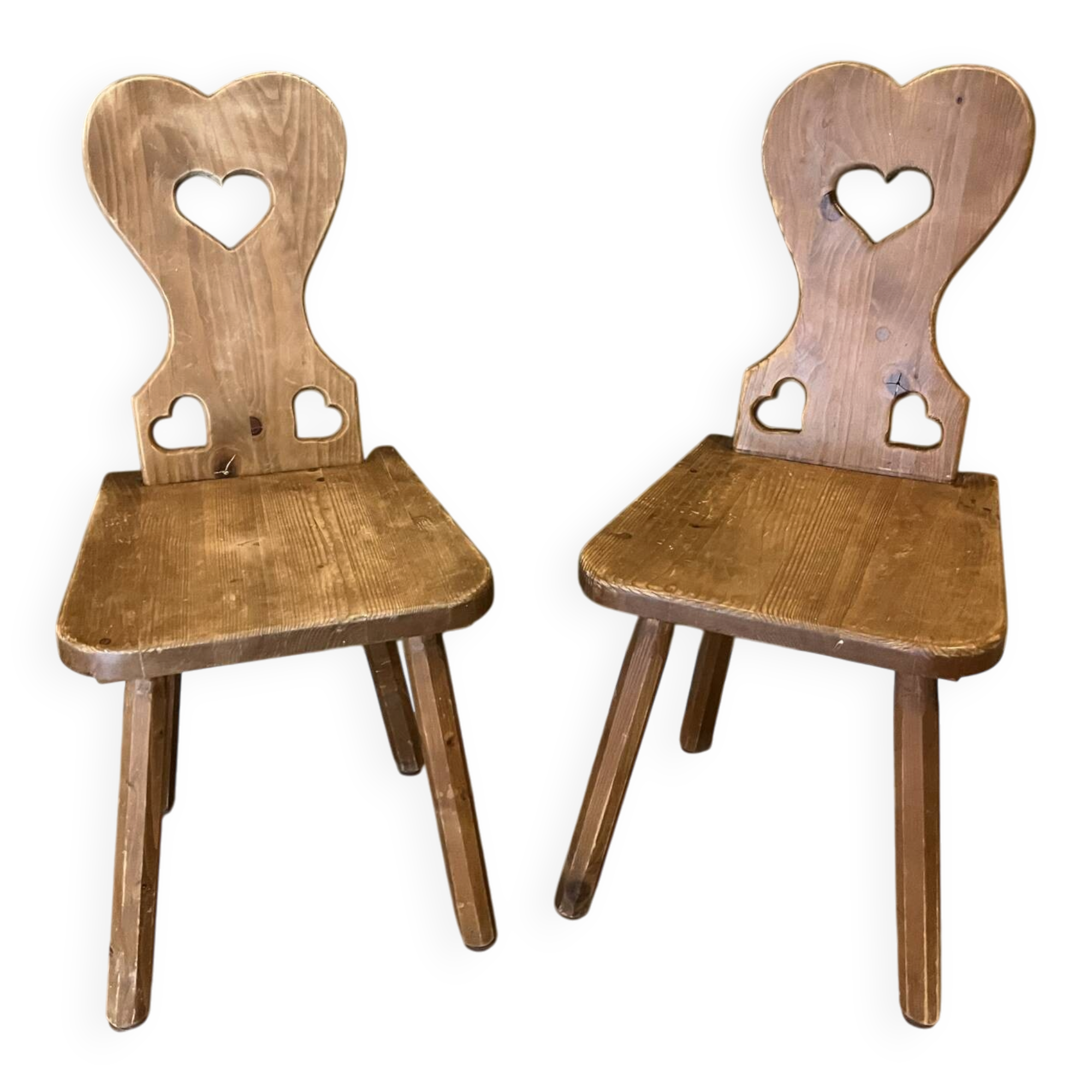 Pair of vintage wooden chairs in alpine chalet style.