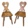 Pair of vintage wooden chairs in alpine chalet style.