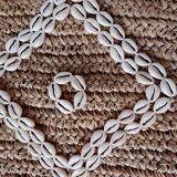 Cushion cover in natural raffia, shells and embroidery in macramé.