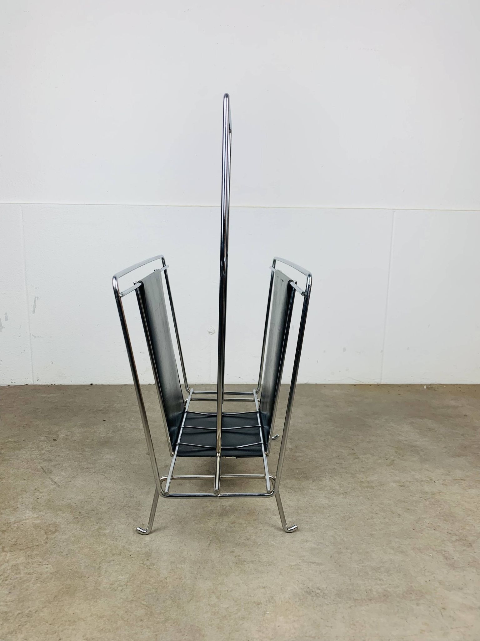 Chrome and black leather magazine rack, 1970s.