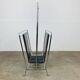 Chrome and black leather magazine rack, 1970s.