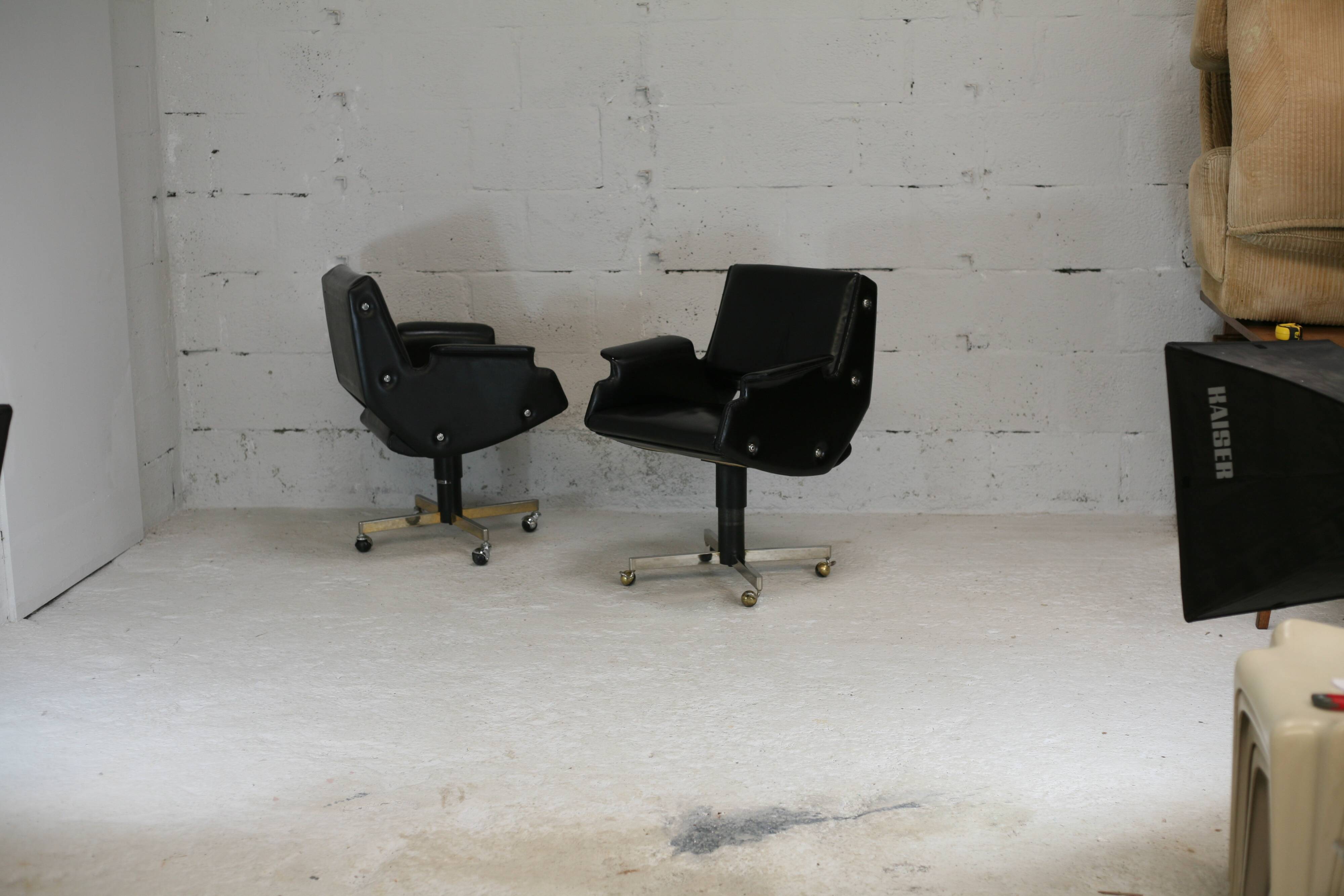 Pair of swivel armchairs, imitation leather and steel, Italy, circa 1960.