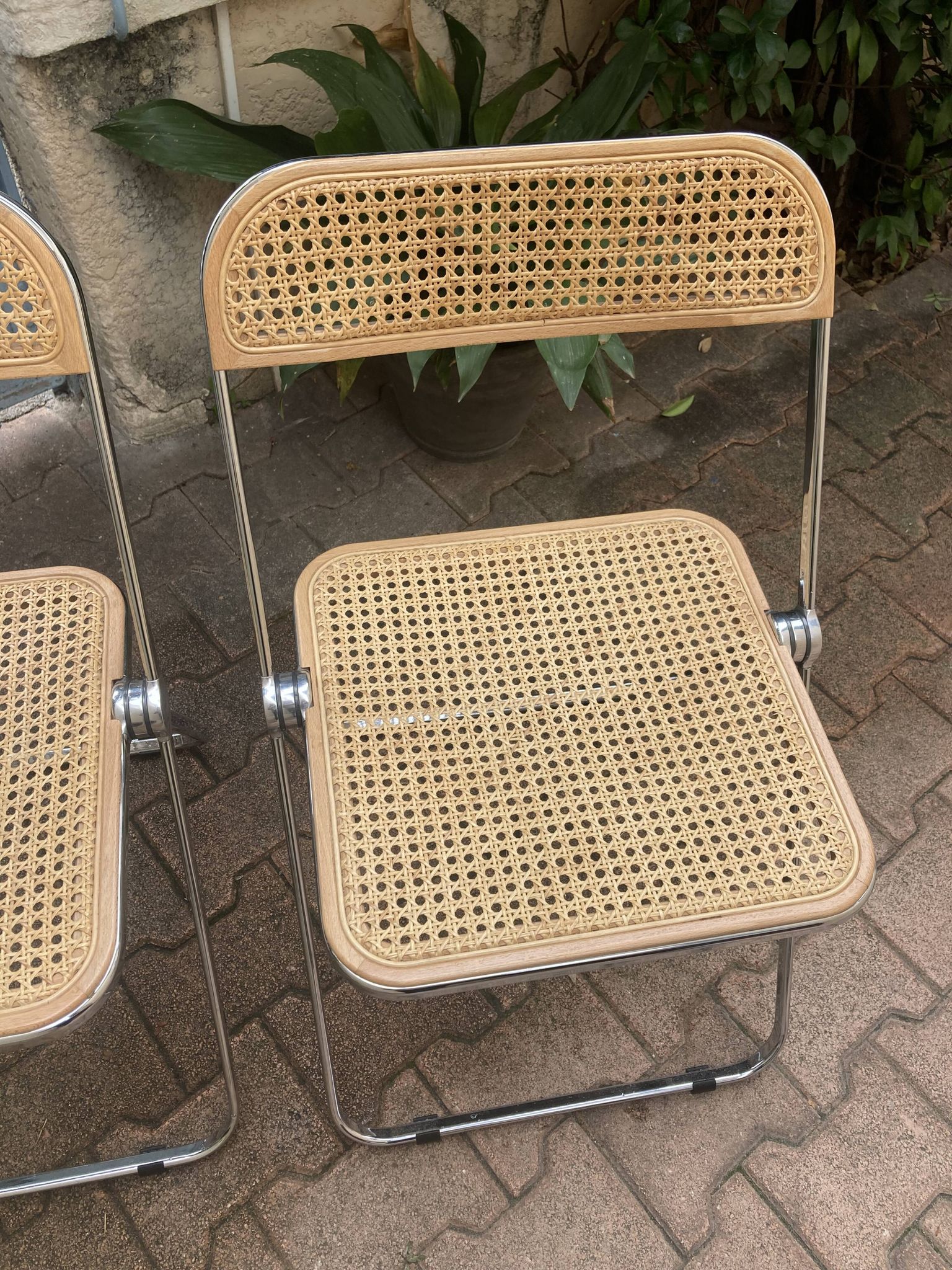 Plia chairs by Castelli in wood and cane.