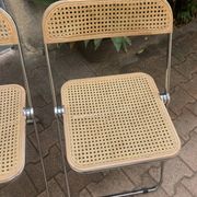 Plia chairs by Castelli in wood and cane.