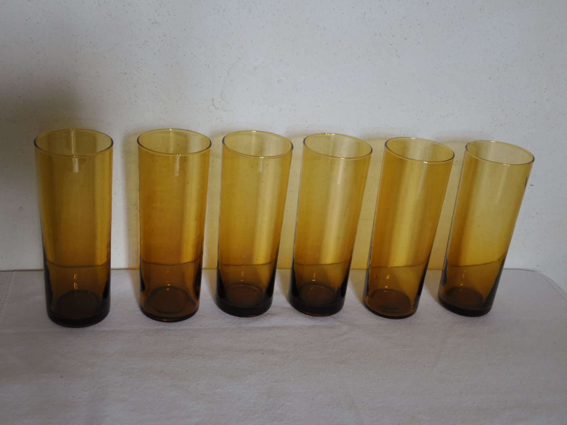 6 glasses orangeade in their leather bucket