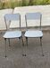 2 beige Formica and steel chairs from the 1980s.
