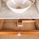 Antique washbasin cabinet in solid pitch pine with a white marble top.
