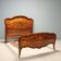 Antique baroque double bed in walnut and mahogany, 20th century.