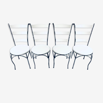 White chairs in exotic wood and wrought iron