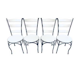 White chairs in exotic wood and wrought iron