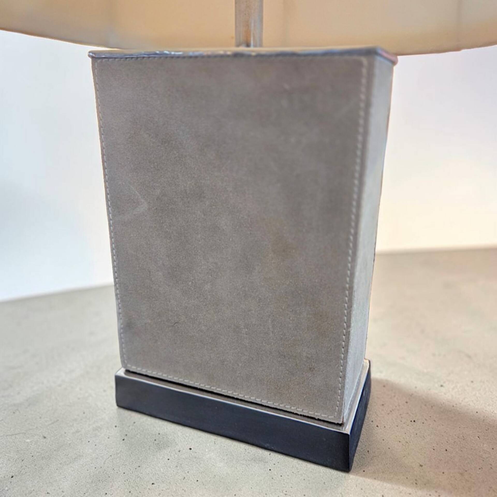 Stainless steel and suede lamp