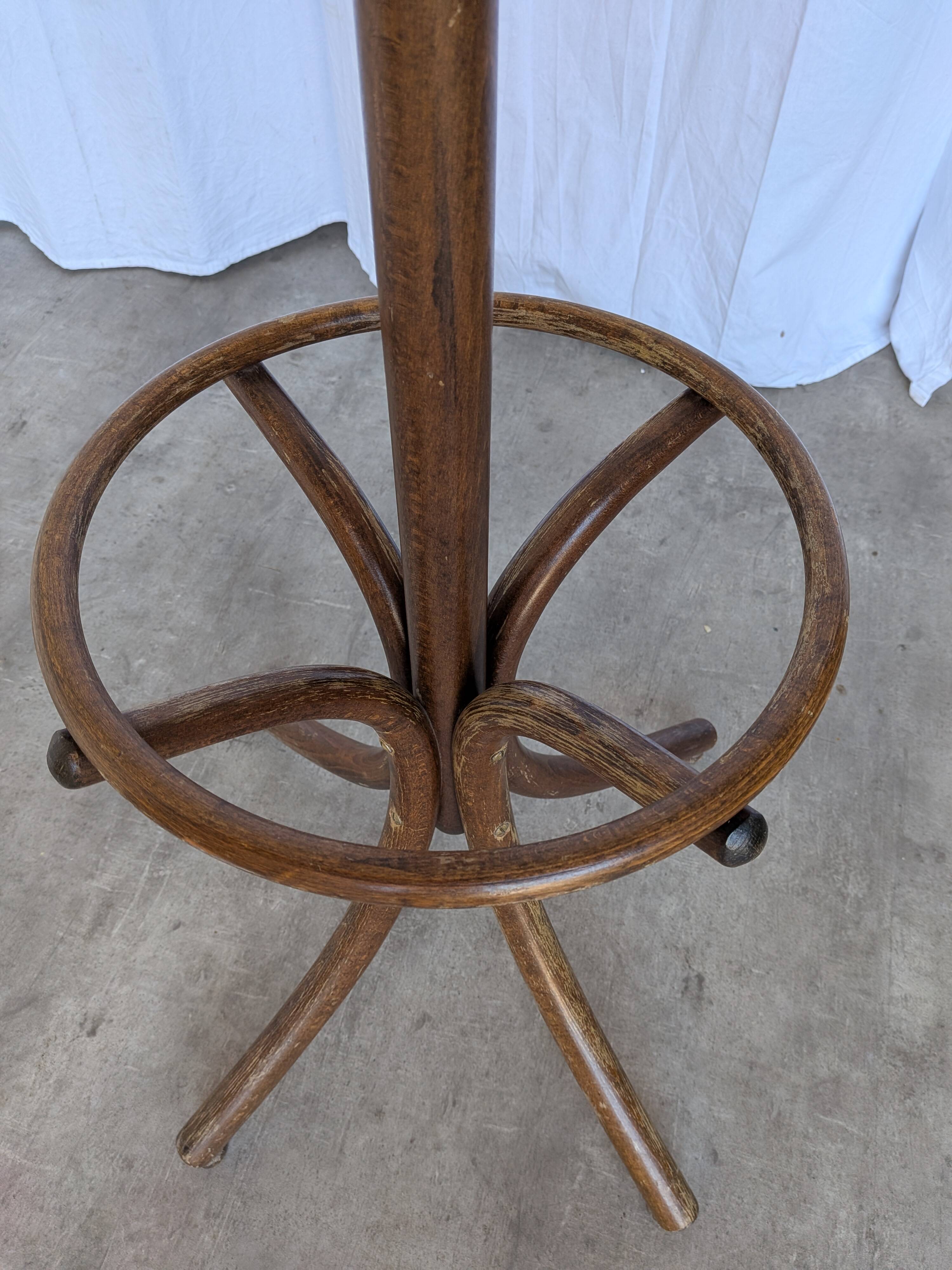 Vintage bentwood coat rack in Thonet style / Dark wood coat rack with shadow.