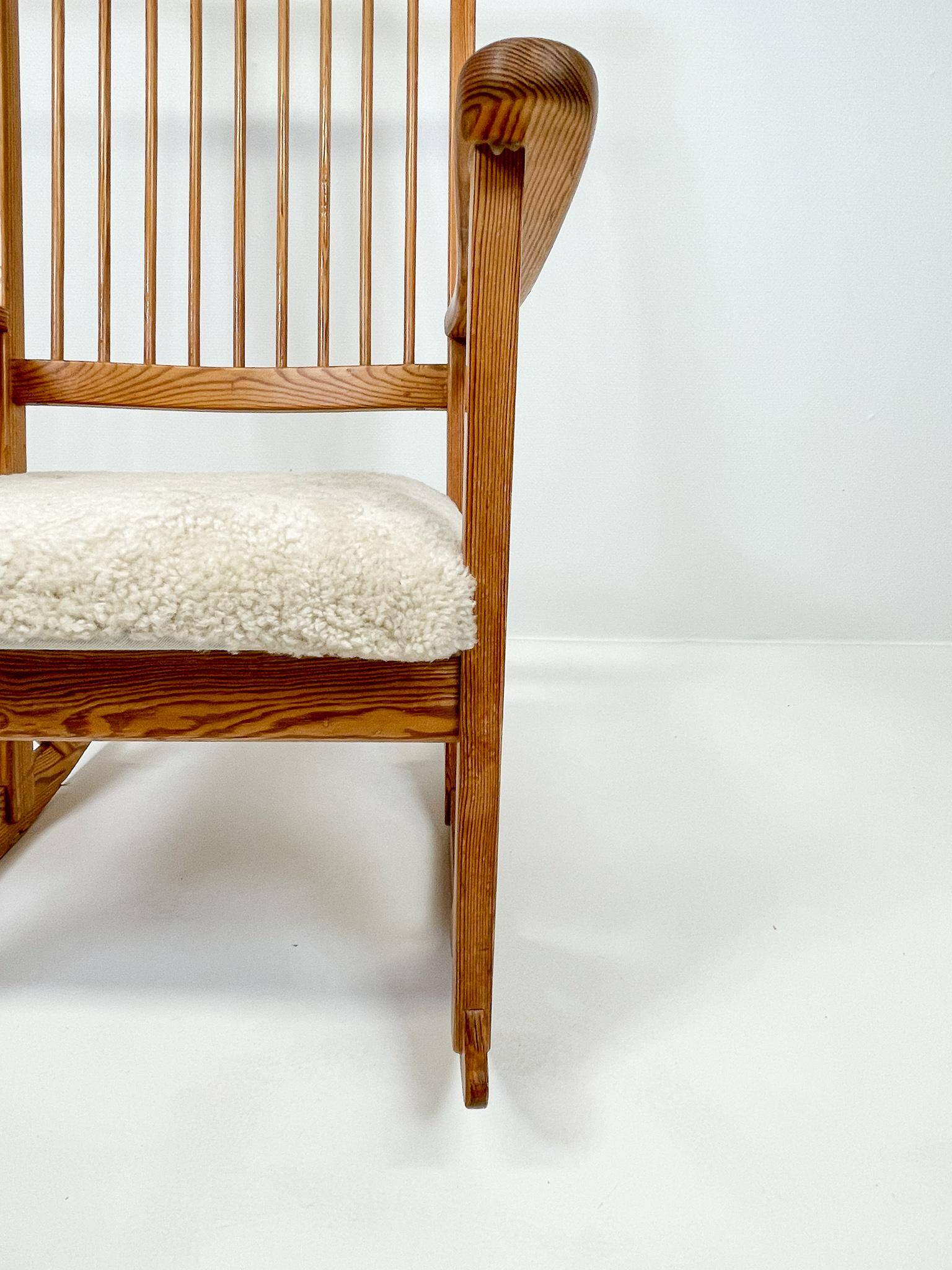 Mid-century rocking chair in pine and sheepskin by Yngve Ekström, Sweden.