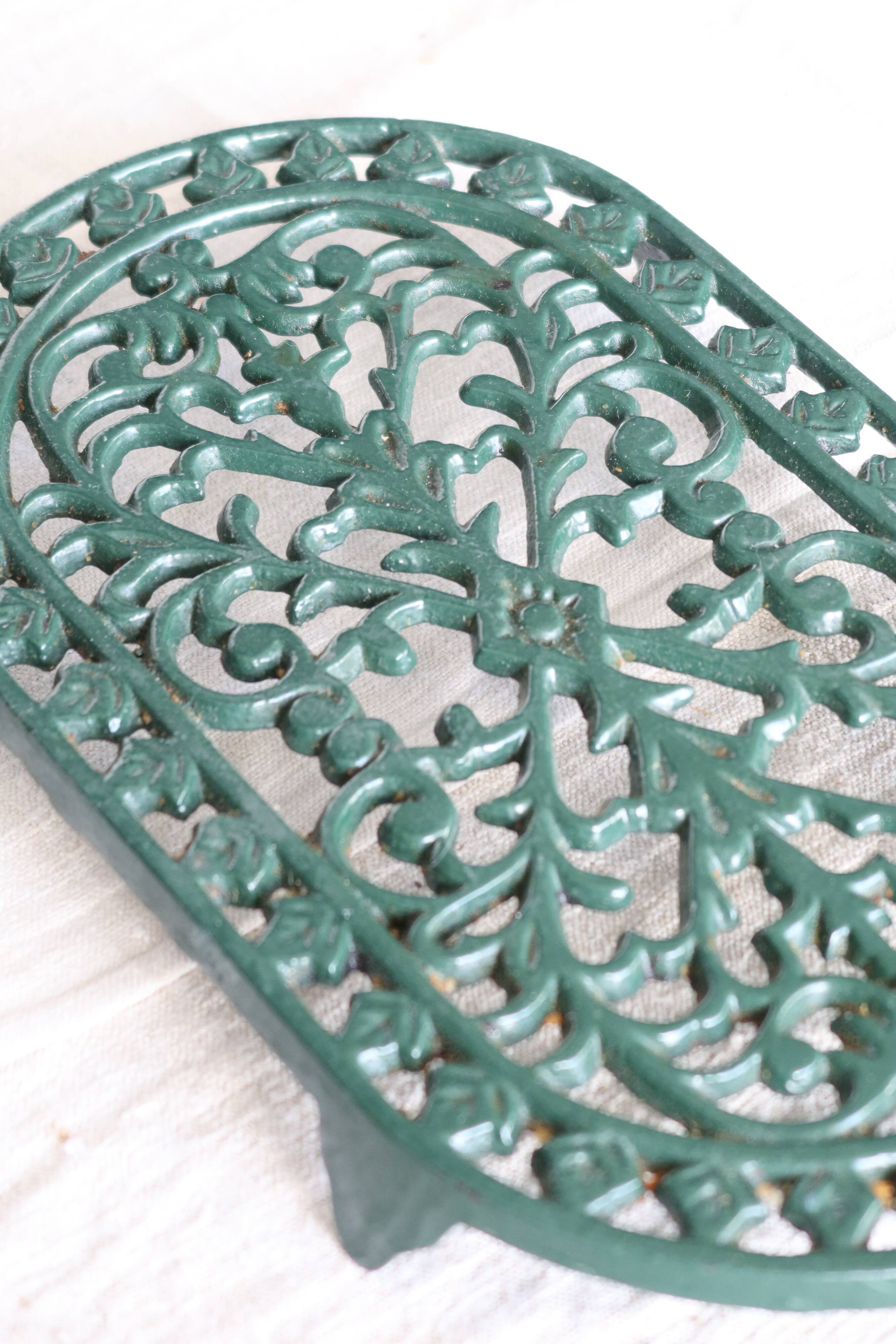 Vintage dark green cast iron oval trivet - Openwork design