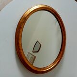 Antique oval mirror in gilded solid wood