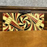 Art Nouveau period bed in painted iron faux wood with stylized colored patterns