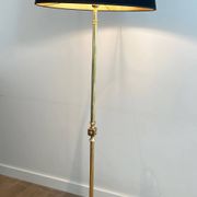 Neoclassical brass floor lamp with claw feet from Maison Jansen.