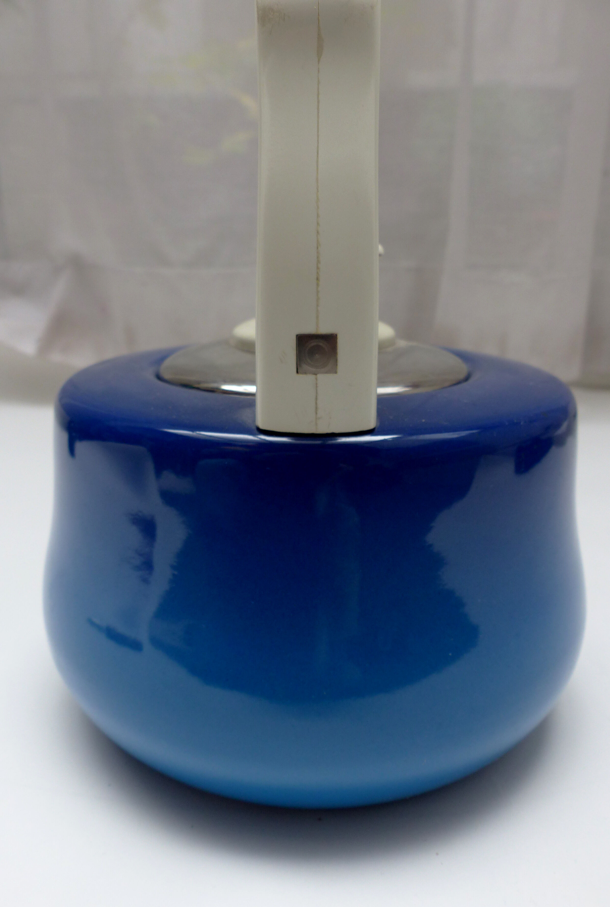 Old blue enamelled kettle