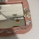 Vintage floral pink ceramic framed mirror signed St-Avit Francalat.