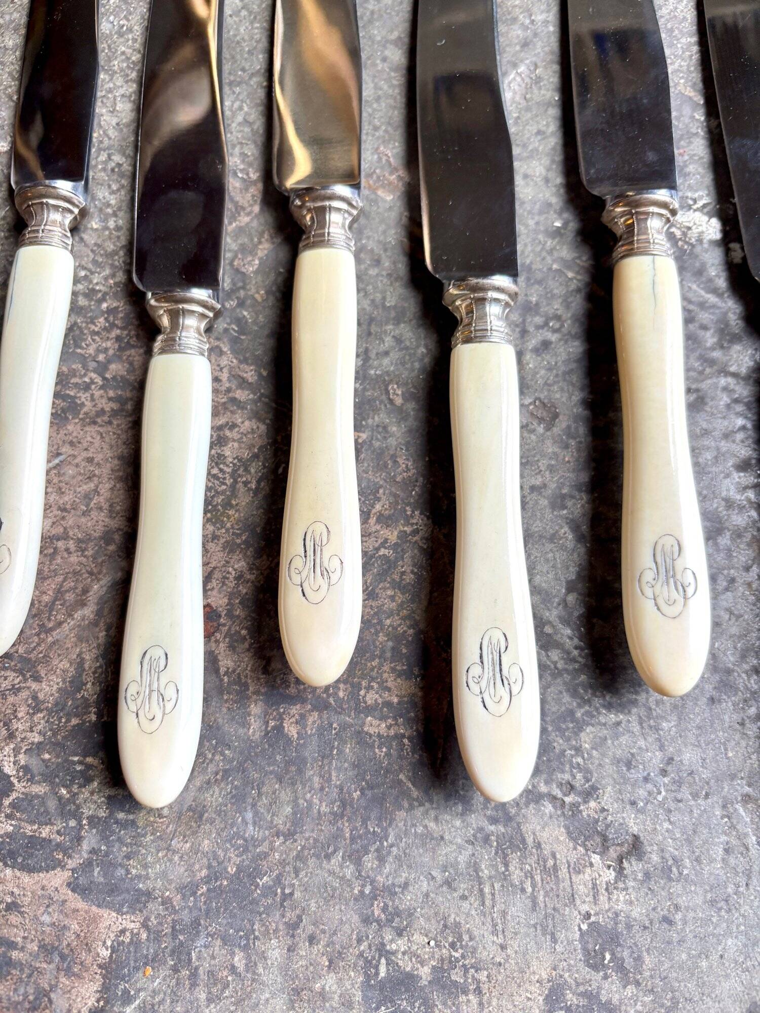 12 stainless steel and monogrammed bone knives