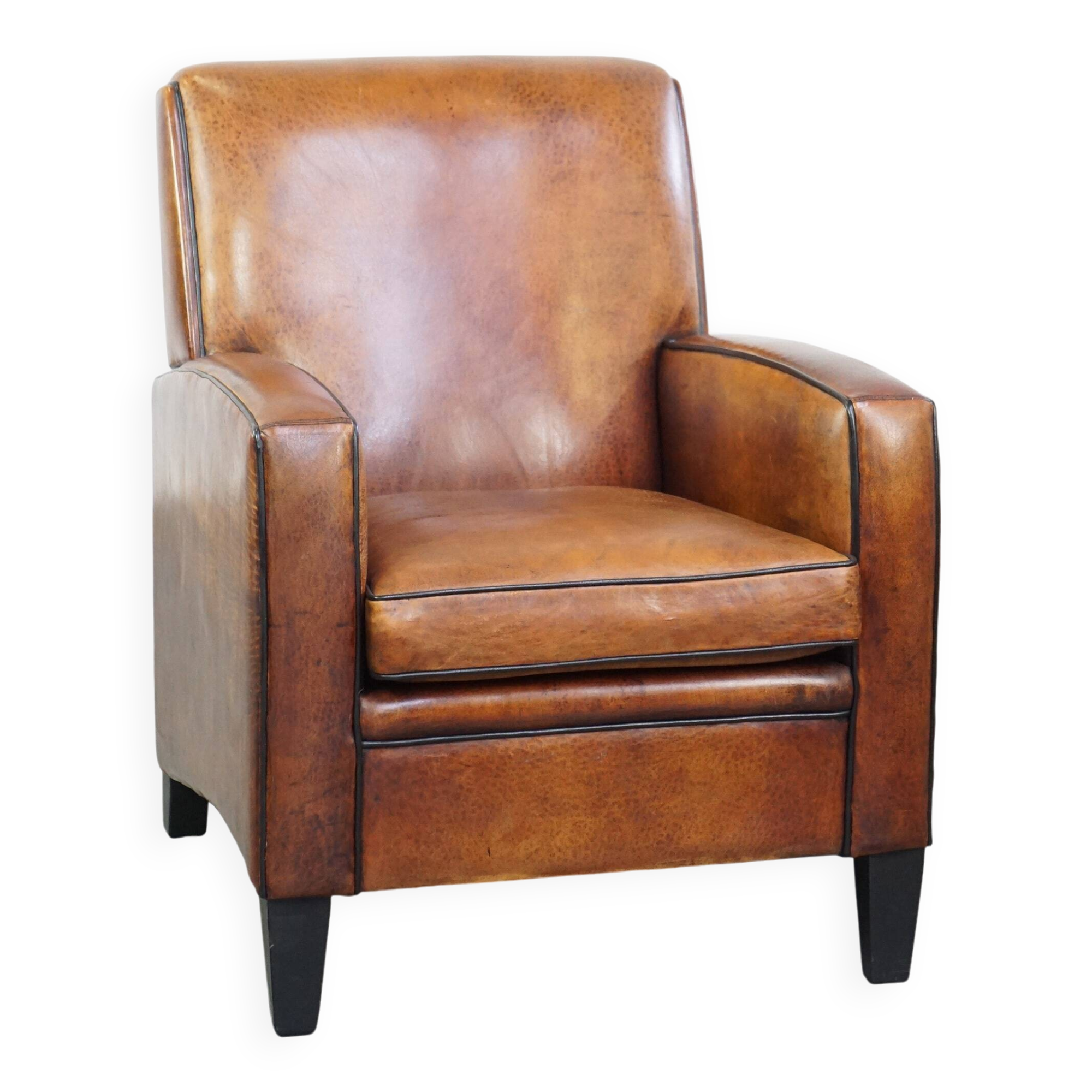 Art Deco design sheepskin leather armchair with a stunning patina
