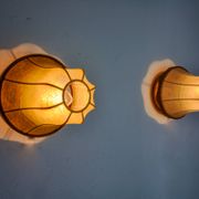 Pair of "cocoon" wall lights, pear shape, resin and pine, Italy, 1970