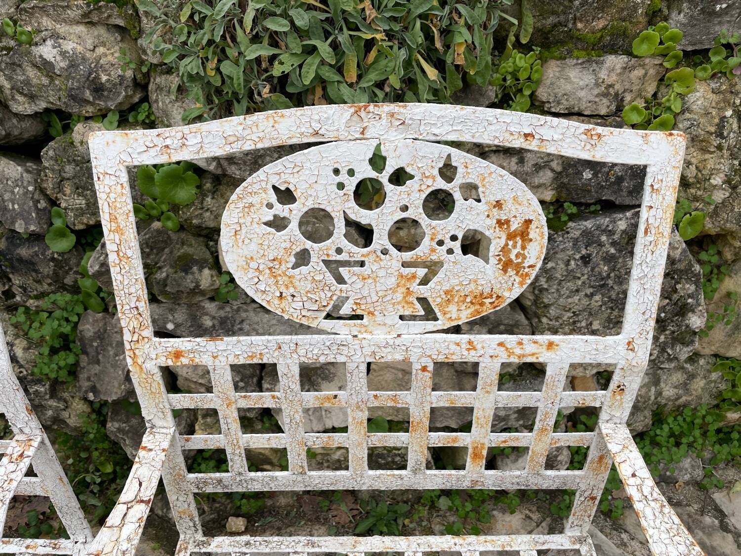 Pair of wrought iron armchairs