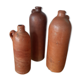 Lot de trois bouteilles anciennes en grès