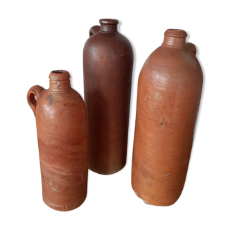 Set of three old sandstone bottles