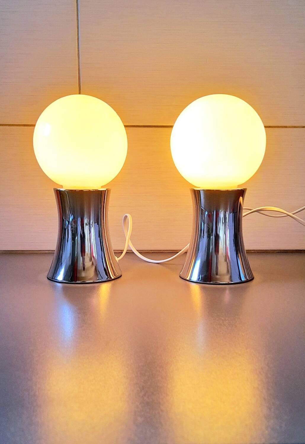 Pair of chromed metal and opaline lamps, 1980.