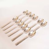 Silver plated metal service: 12 soup spoons, 12 forks and ladle.