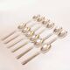 Silver plated metal service: 12 soup spoons, 12 forks and ladle.